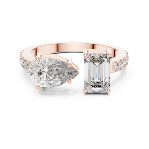 A front close-up view of a luxury Toi et Moi lab-grown diamond engagement ring crafted in solid rose gold, featuring a 0.86 carat emerald-cut diamond and a 1.00 carat pear-shaped diamond on a pavé accented open band.