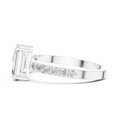 A side view of a luxury Toi et Moi lab-grown diamond engagement ring crafted in solid white gold, showcasing the emerald-cut center diamond and brilliant pavé diamonds along the band.