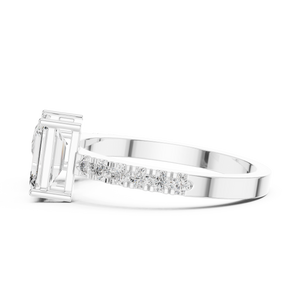 A side view of a luxury Toi et Moi lab-grown diamond engagement ring crafted in solid white gold, showcasing the emerald-cut center diamond and brilliant pavé diamonds along the band.