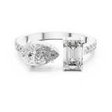 A front close-up view of a luxury Toi et Moi lab-grown diamond engagement ring in solid white gold, featuring a 0.86 carat emerald-cut diamond and a 1.00 carat pear-shaped diamond on a pavé accented open band.