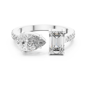 A front close-up view of a luxury Toi et Moi lab-grown diamond engagement ring in solid white gold, featuring a 0.86 carat emerald-cut diamond and a 1.00 carat pear-shaped diamond on a pavé accented open band.