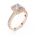 Rose gold emerald cut engagement ring with diamond halo and pave band