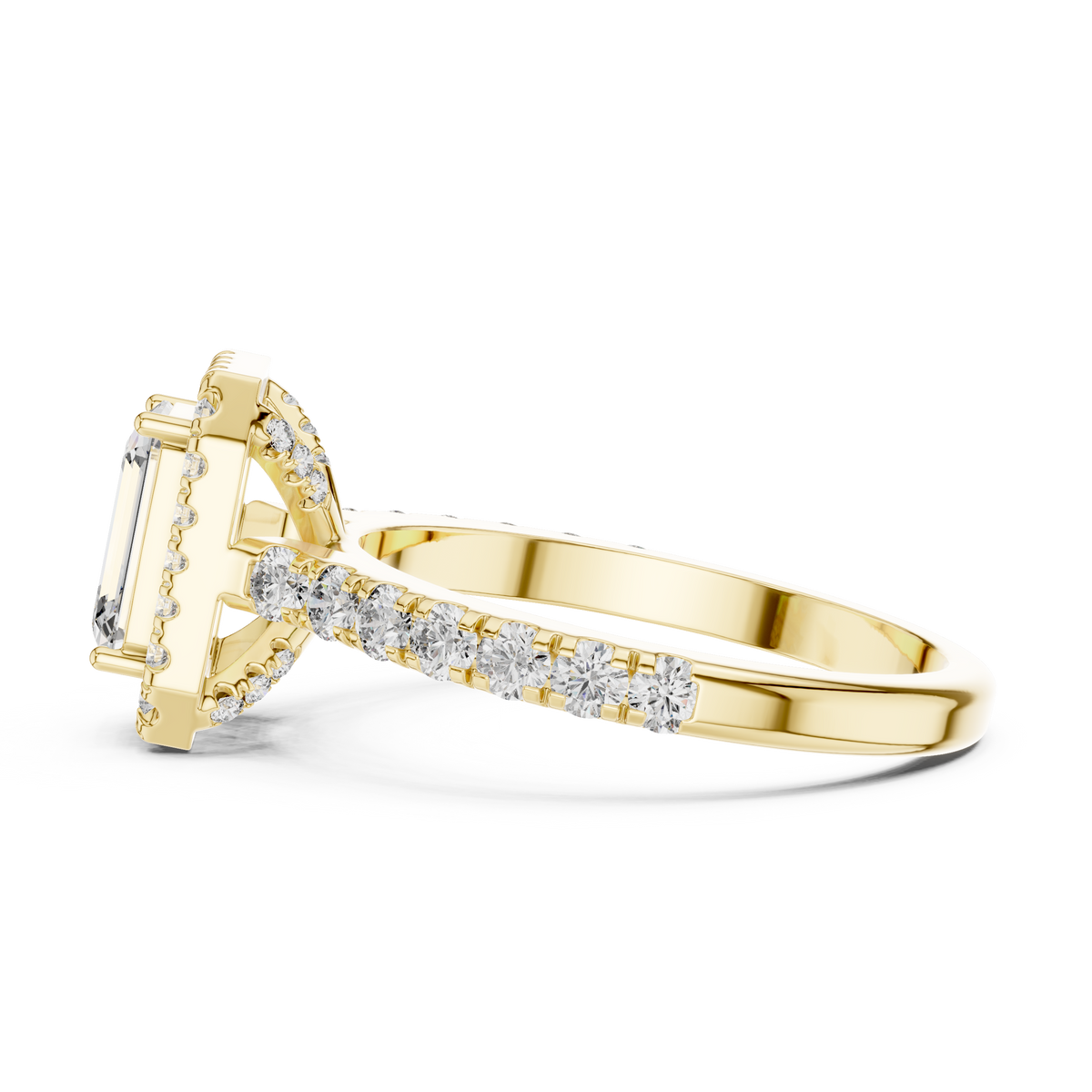 Low angle side view of yellow gold emerald cut engagement ring showing halo and pave band