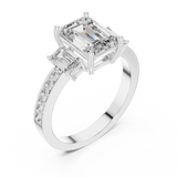 Side profile of white gold three-stone emerald cut diamond ring