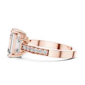 Side view of rose gold 3-stone emerald cut diamond ring