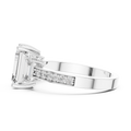 Side profile of white gold three-stone emerald cut diamond ring