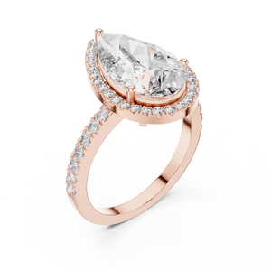 Pear-cut diamond halo engagement ring in rose gold setting