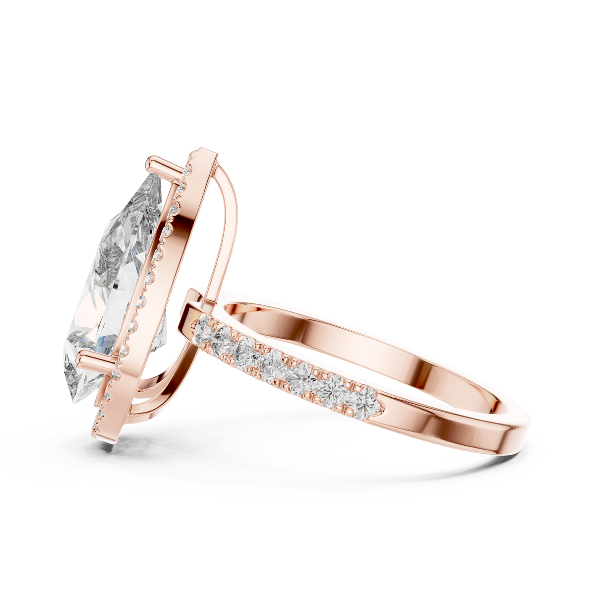Side view of a pear-cut diamond engagement ring with a hidden halo in rose gold