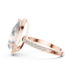 Side view of a pear-cut diamond engagement ring with a hidden halo in rose gold