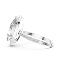 Side profile of a pear-cut diamond engagement ring in white gold with a delicate hidden halo