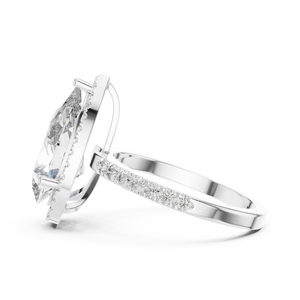Side profile of a pear-cut diamond engagement ring in white gold with a delicate hidden halo