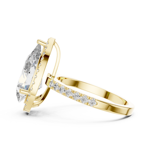 Side profile of a pear-cut diamond engagement ring in yellow gold with a hidden halo