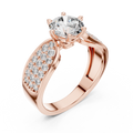 Rose gold split shank engagement ring featuring a round brilliant-cut lab-grown diamond center stone and pavé-set diamond shoulders on a transparent background.