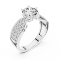 Close-up view of a white gold split shank engagement ring featuring a round lab-grown diamond center stone and pavé-set diamond shoulders on a transparent background.