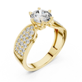 Close-up of a yellow gold split shank engagement ring featuring a round lab-grown diamond center stone and pavé-set diamond shoulders on a transparent background.