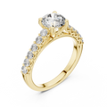 Yellow gold round cut lab-grown diamond engagement ring with side stones on a transparent background