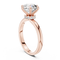 Rose gold round solitaire lab-grown diamond engagement ring with six-prong setting on white background