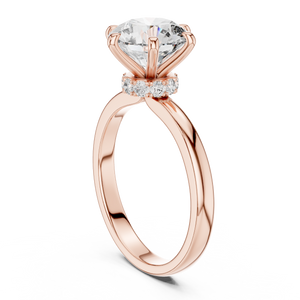Rose gold round solitaire lab-grown diamond engagement ring with six-prong setting on white background