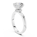 White gold round solitaire lab-grown diamond engagement ring with six-prong setting and hidden halo.