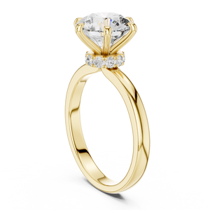 Gold ring with a large diamond and smaller diamonds on a white background