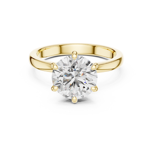 Yellow gold round solitaire lab-grown diamond engagement ring with six-prong setting on transparent background.


