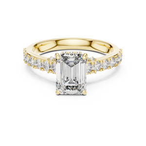 Gold ring with a large diamond and smaller diamonds on the band against a white background