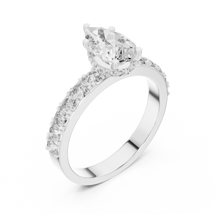 Side angle view of pear cut lab diamond engagement ring showing hidden halo and pave setting in white gold