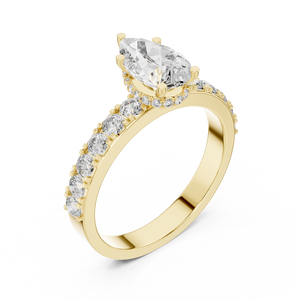Side view of a 1.10 CT pear cut lab grown diamond engagement ring with pave band in yellow gold
