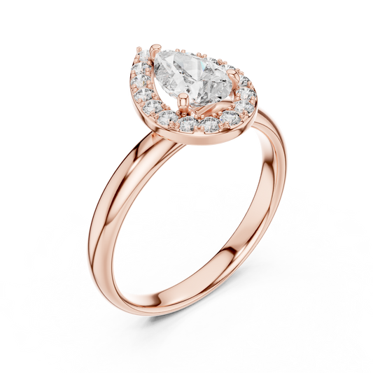 0.70 CT pear cut lab grown diamond halo engagement ring in rose gold, angled view