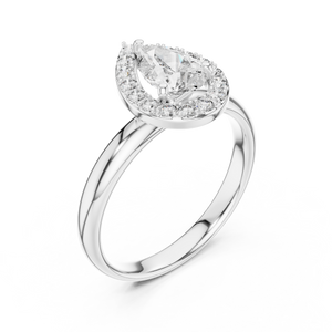 Diamond ring with a pear-shaped center stone on a white background