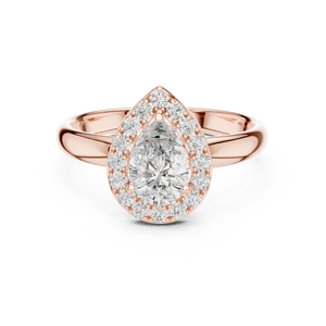 Rose gold ring with a pear-shaped diamond on a white background