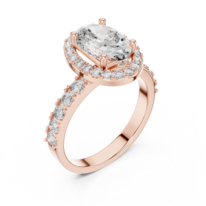 Rose gold ring with a large oval-cut center diamond, a sparkling diamond halo, and pavé-set side stones on a white background.