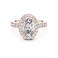 Rose gold ring with a large oval-cut center diamond, a sparkling diamond halo, and pavé-set side stones on a white background.