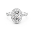 White gold 1.60 CT oval cut lab grown diamond halo engagement ring with pavé side stones on a white background.