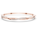 Rose gold twisted diamond bangle bracelet, close-up view