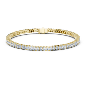 Yellow gold oval cut diamond tennis bracelet, close-up view