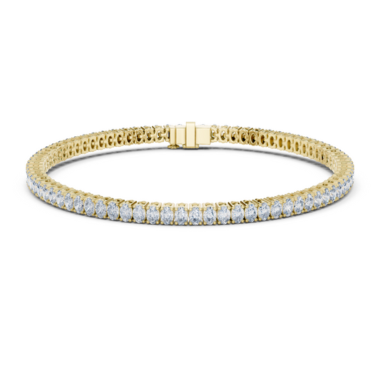 Yellow gold oval cut diamond tennis bracelet, close-up view