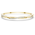 Yellow gold twisted diamond bangle bracelet, close-up view