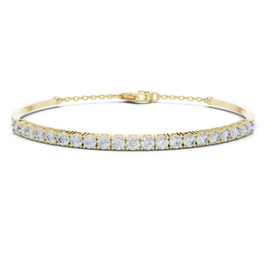 Yellow gold diamond bar bangle bracelet, close-up view