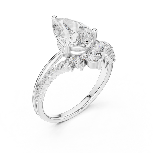 White gold lab grown diamond pear cut ring with crescent accents, angled view