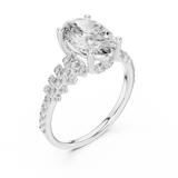 White gold lab grown diamond oval cut ring with scattered accents, angled view