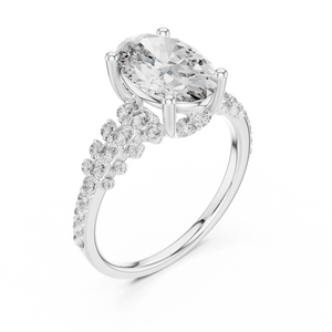 White gold lab grown diamond oval cut ring with scattered accents, angled view