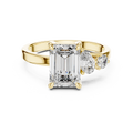 White gold lab grown diamond emerald cut ring with asymmetric accents, angled view — Luzora Jewels