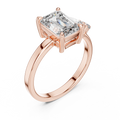 Yellow gold 2 CT lab grown diamond emerald cut ring with asymmetric accents, front view — Luzora Jewels