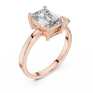 Yellow gold 2 CT lab grown diamond emerald cut ring with asymmetric accents, front view — Luzora Jewels