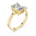 Yellow gold lab grown diamond emerald cut ring with asymmetric accents, angled view — Luzora Jewels