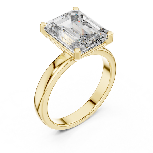 Yellow gold lab grown diamond emerald cut solitaire ring, angled view — Luzora Jewels