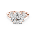 Rose gold lab grown diamond round cut ring with marquise accents, angled view — Luzora Jewels