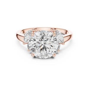 Rose gold lab grown diamond round cut ring with marquise accents, angled view — Luzora Jewels