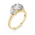 Yellow gold lab grown diamond round cut ring with marquise accents, angled view — Luzora Jewels